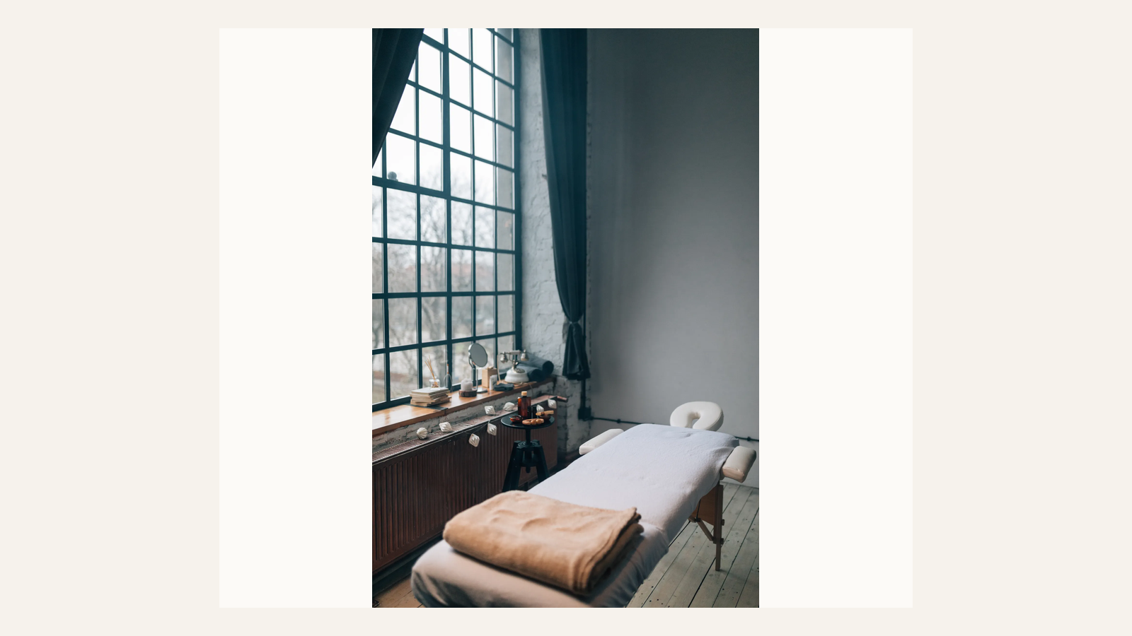 Deep tissue mobile massage setup with firm towels and treatment notes in a London home