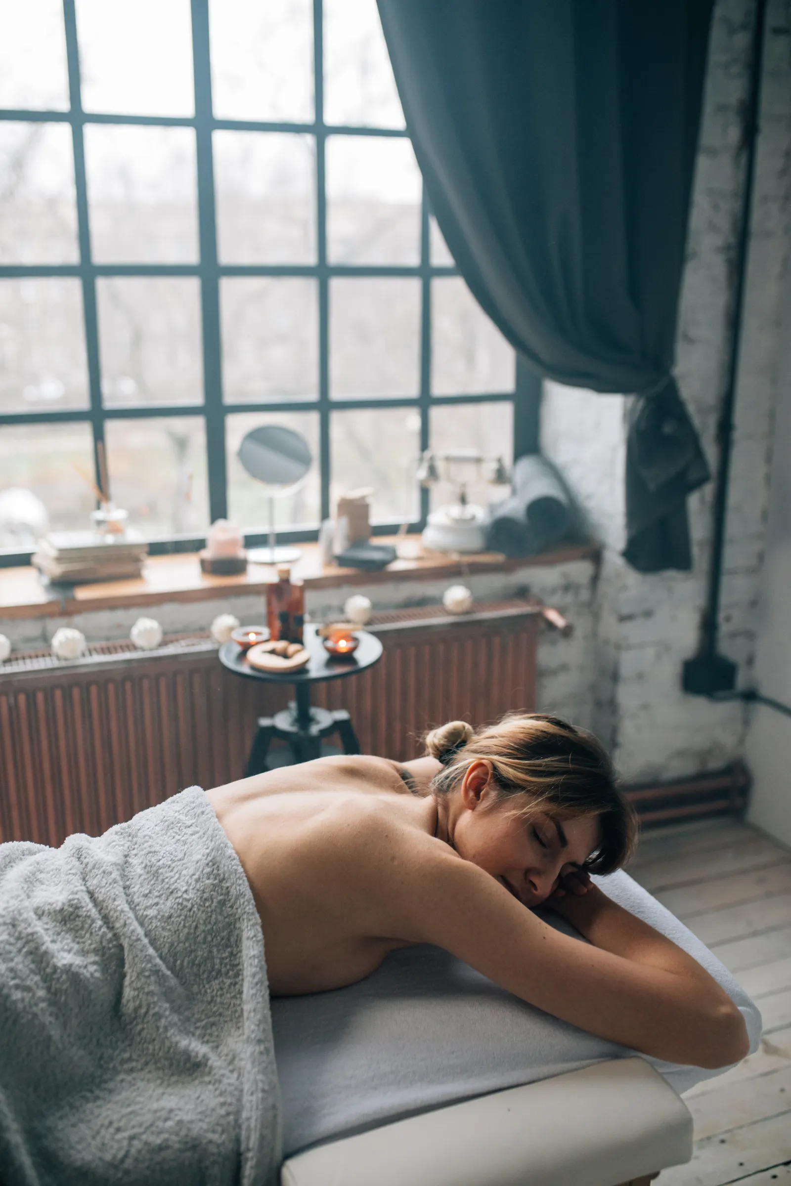 At-home massage setup with receipt-style notes and fresh towels for value comparison