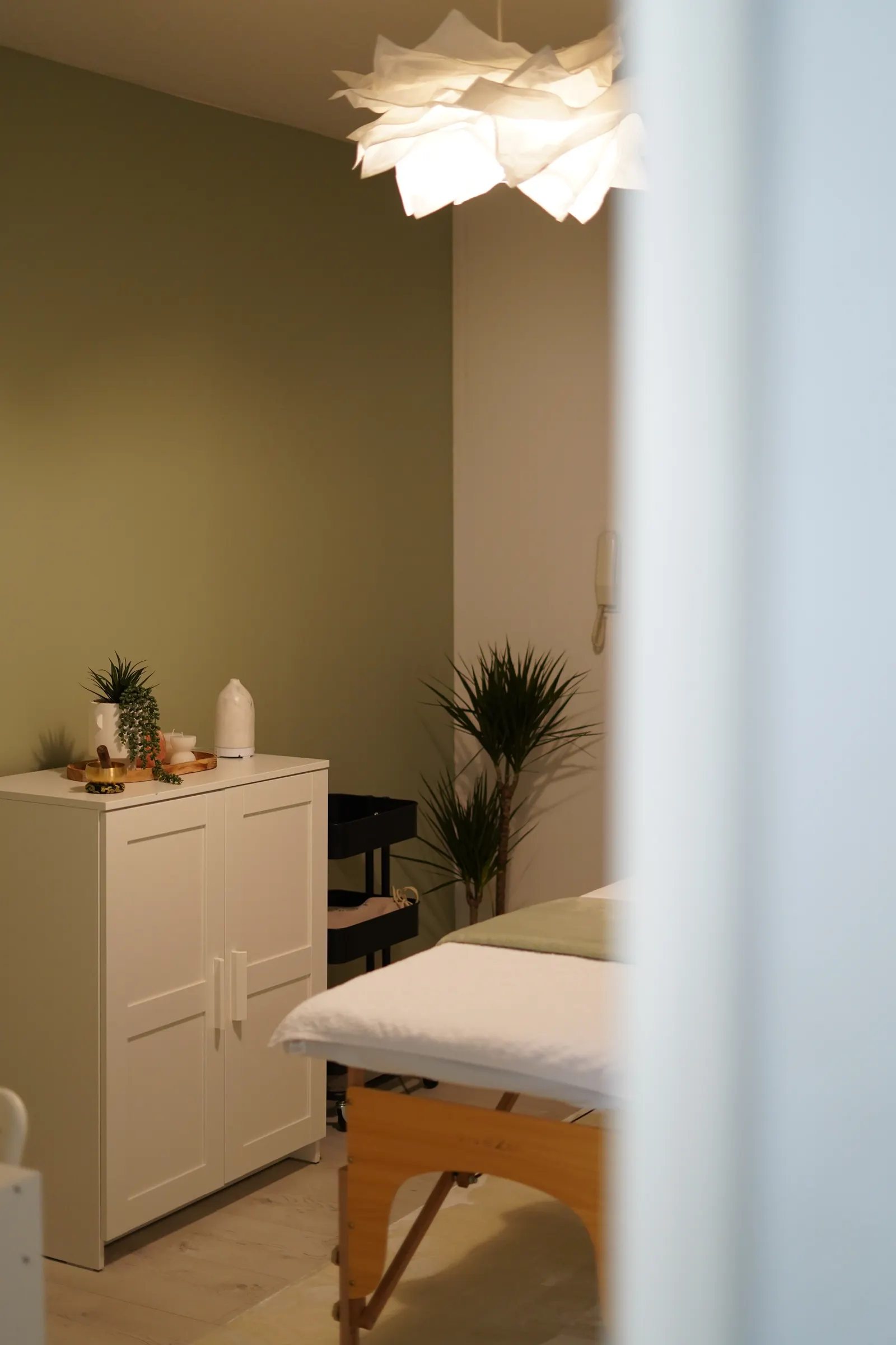 Warm at-home massage space prepared with bolsters for side-lying support