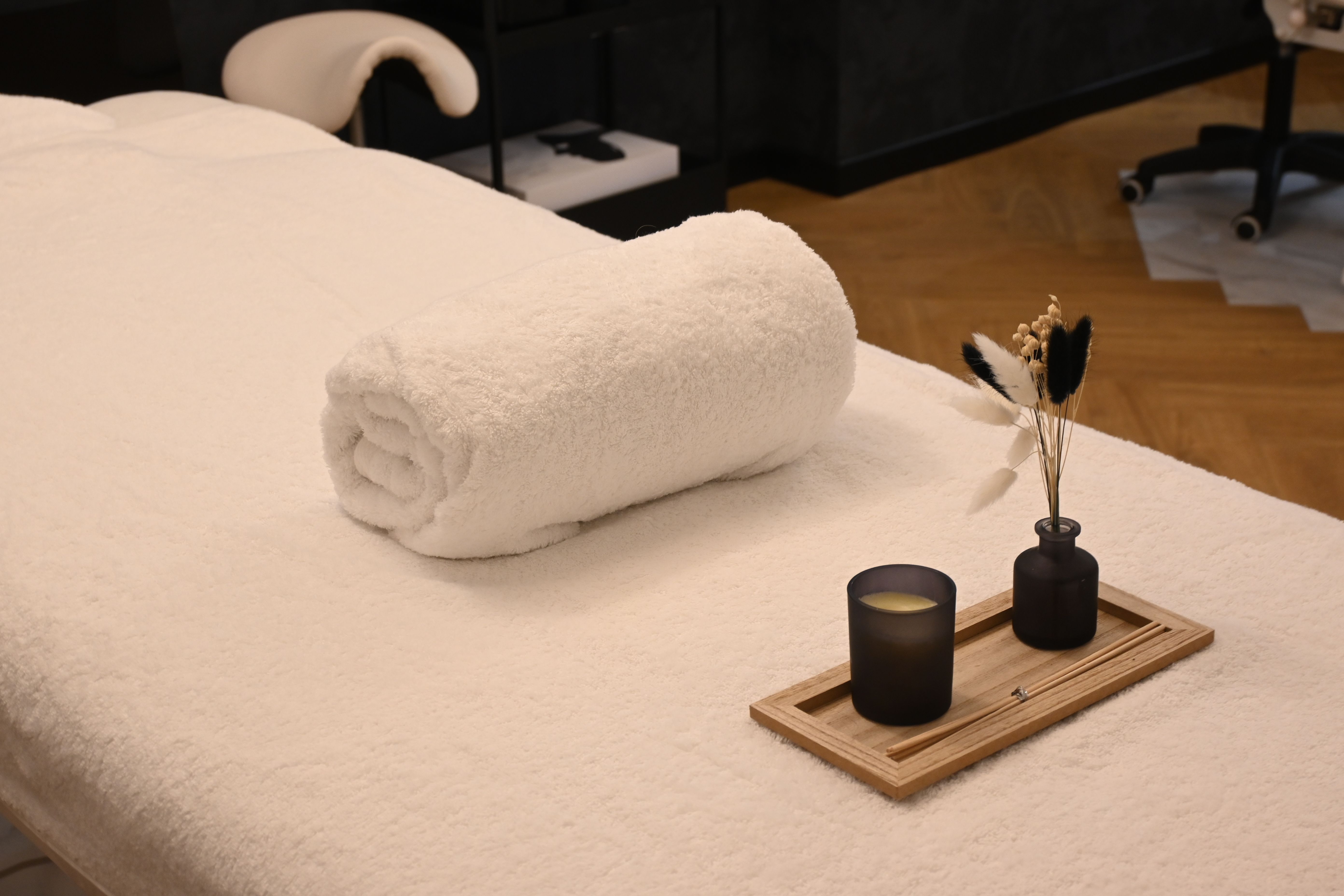 Secret Spa booking comparison notes beside a calendar and massage supplies